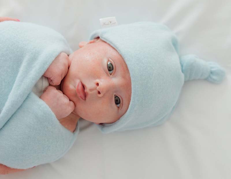 Knotty beanies crafted in soft Plush Powder Blue fabric.