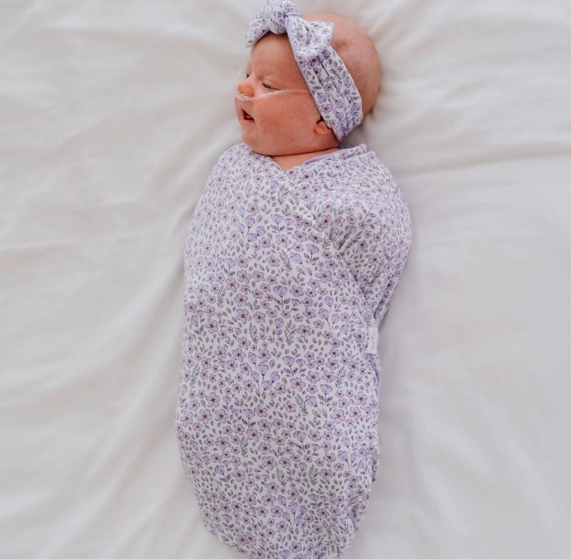 Purple posies design baby onesie outfit in silky modal fabric.