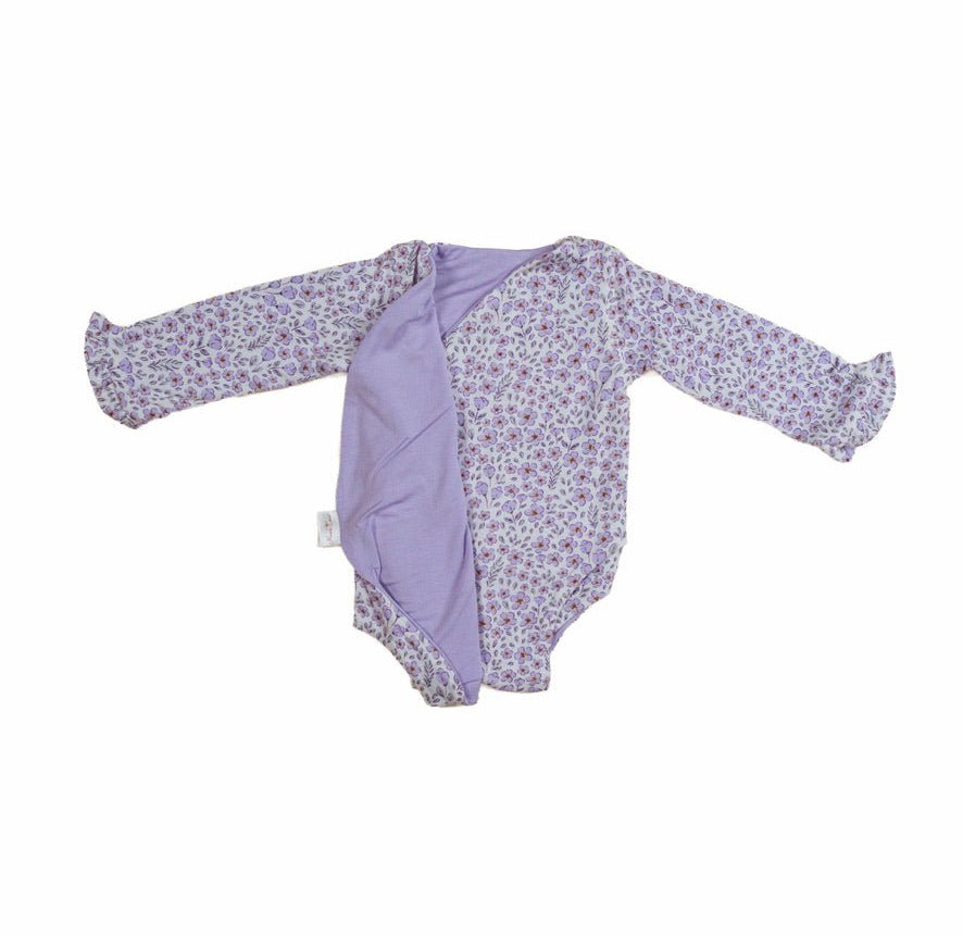 Reversible purple posies design baby onesie outfit in silky modal fabric.