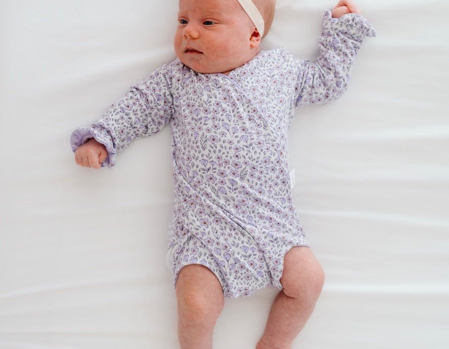 Purple posies design baby onesie outfit in silky modal fabric.