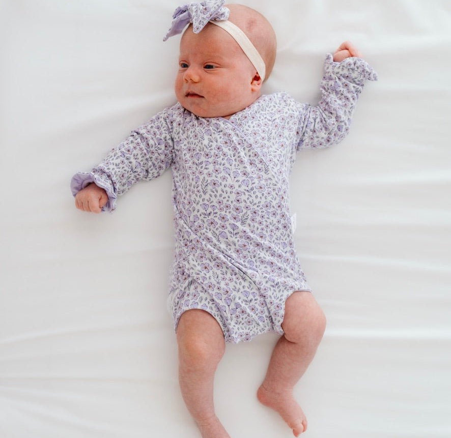 Purple posies design baby onesie outfit in silky modal fabric.