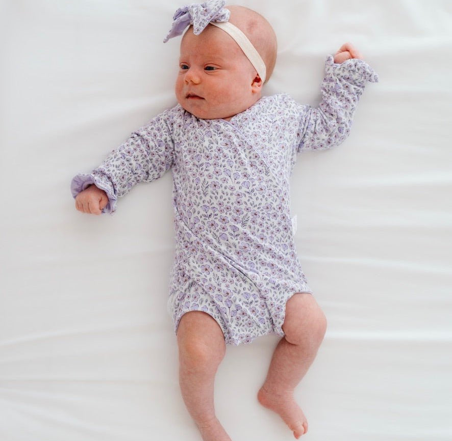 Purple posies design baby onesie outfit in silky modal fabric.