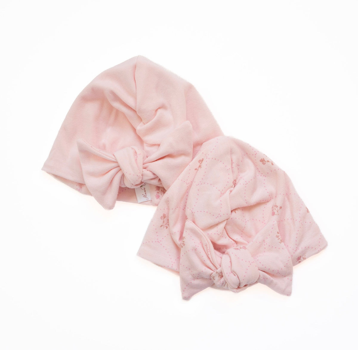 Reversible bamboo cotton baby beanie with ruched bow in dainty dots design.