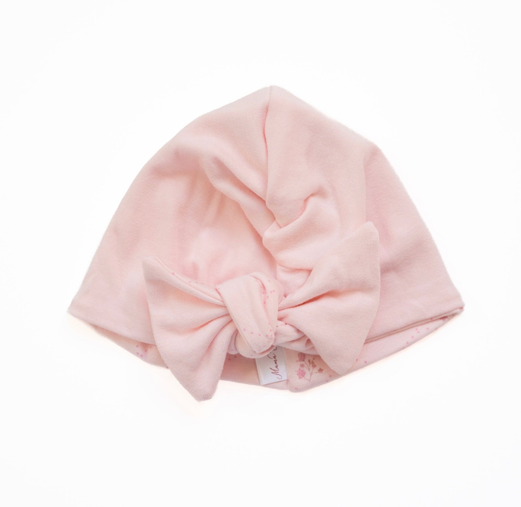 Reversible bamboo cotton baby beanie with ruched bow in dainty dots design.