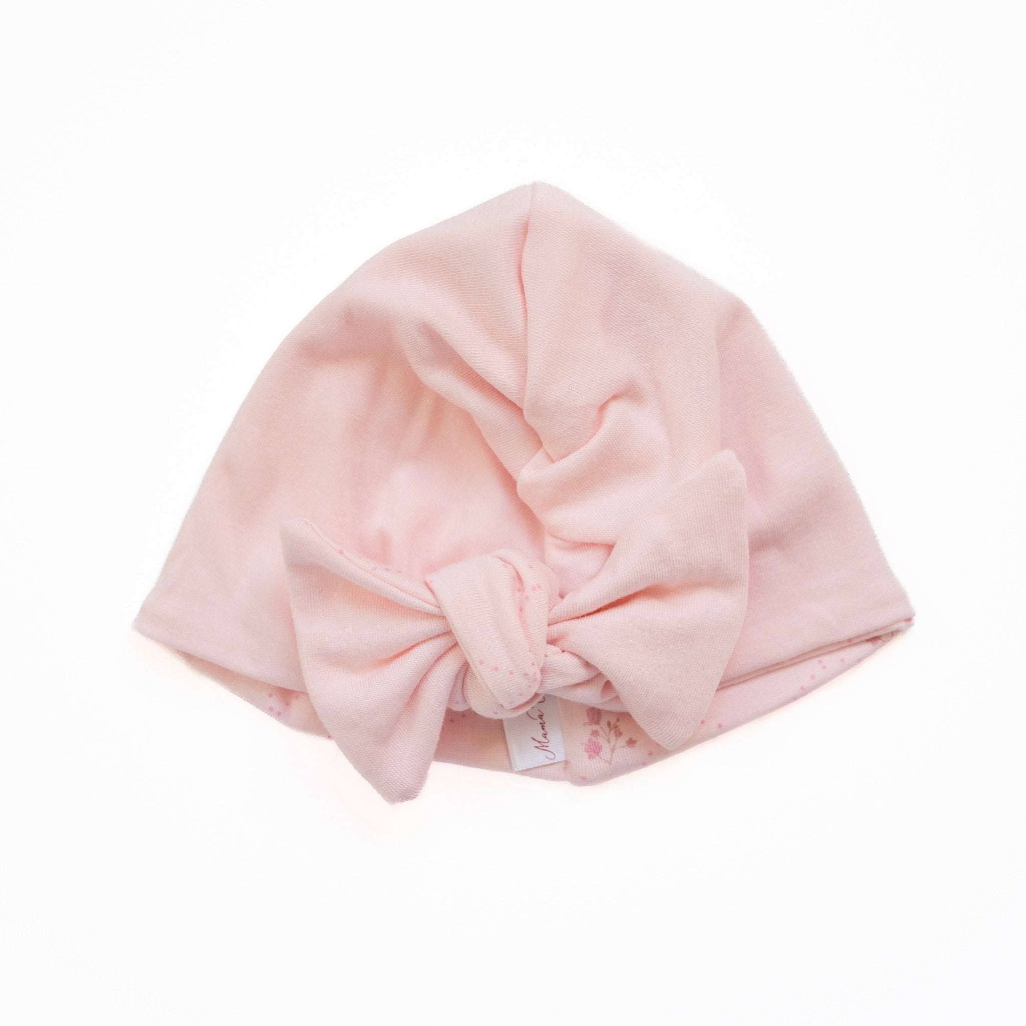 Reversible bamboo cotton baby beanie with ruched bow in dainty dots design.