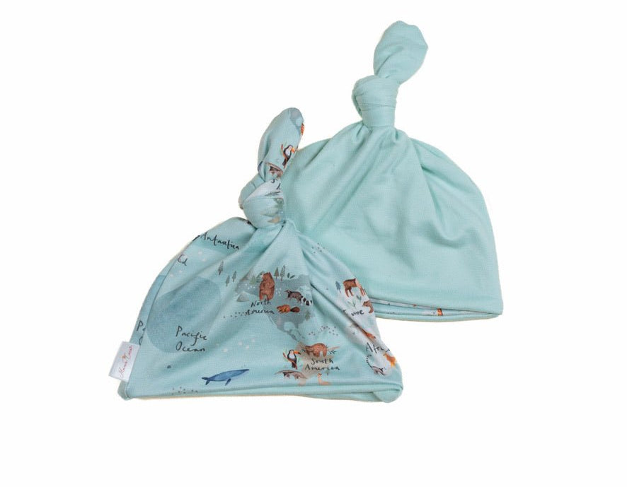 Reversible classic brushed fabric baby knotty beanie in world traveler design.