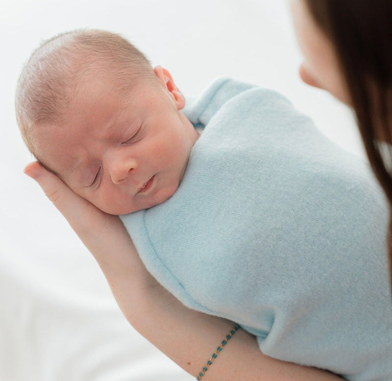 Reversible Baby Cocoon swaddle baby blanket in plush powder blue design in plush dream fabric styles.