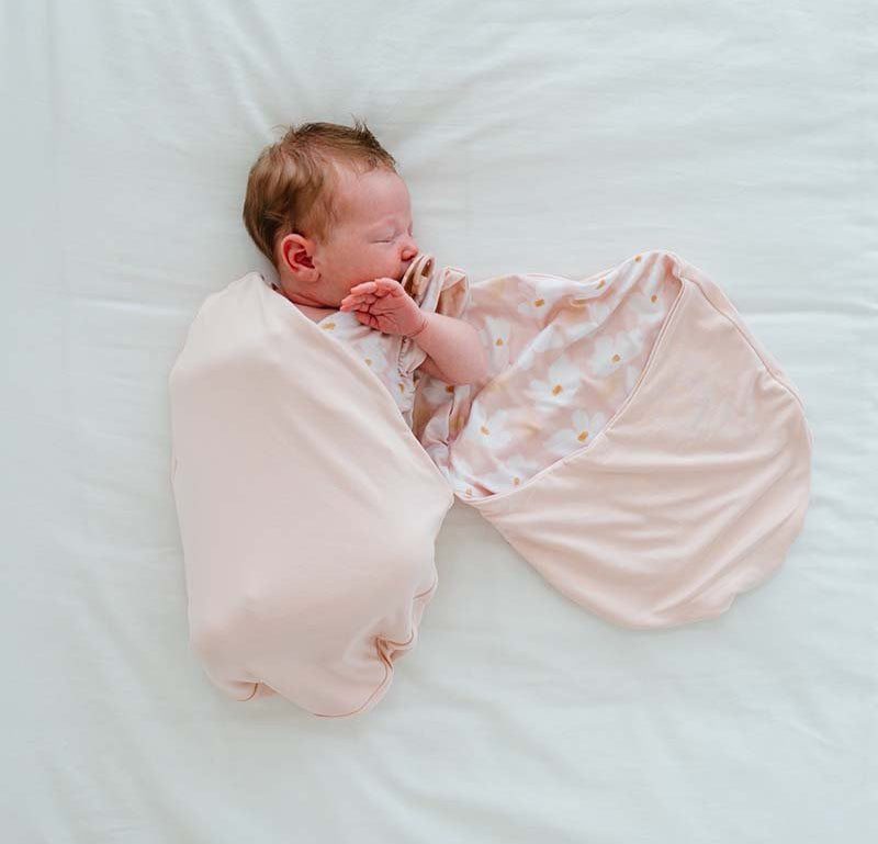 Reversible Silky Modal baby cocoon swaddle with classic Sweet Lily print.