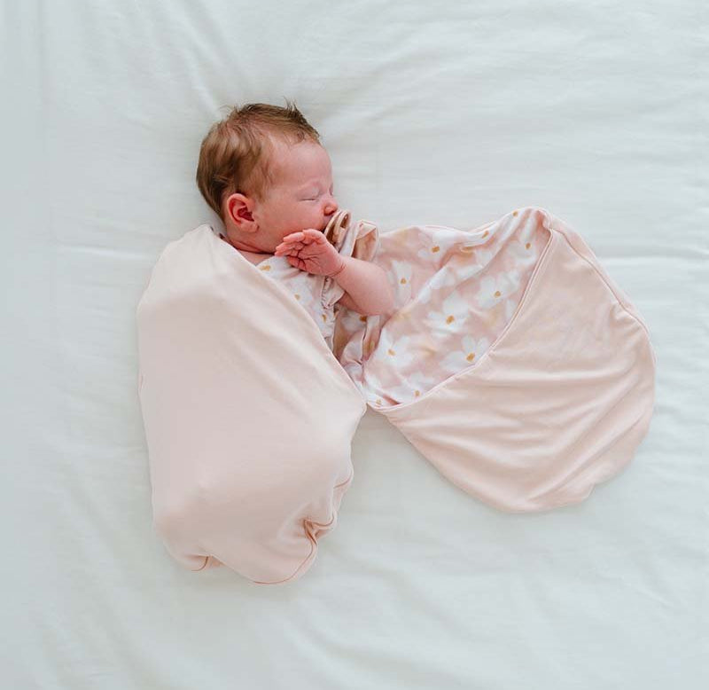 Reversible Silky Modal baby cocoon swaddle with classic Sweet Lily print.