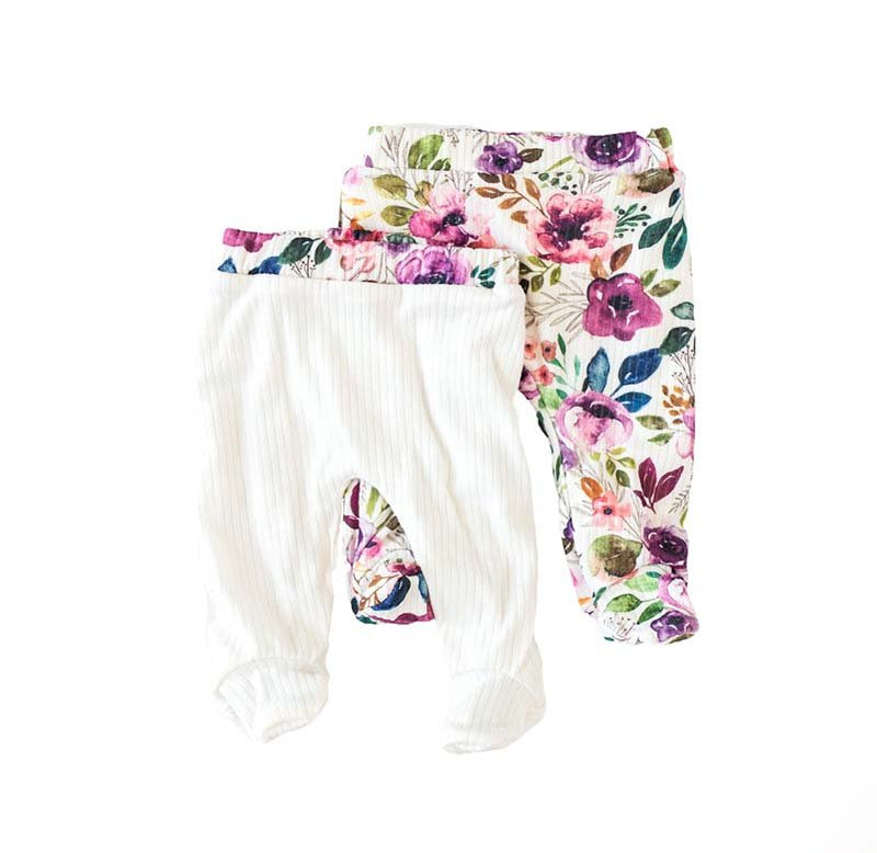 Reversible footie pants in ivory wildflowers design.