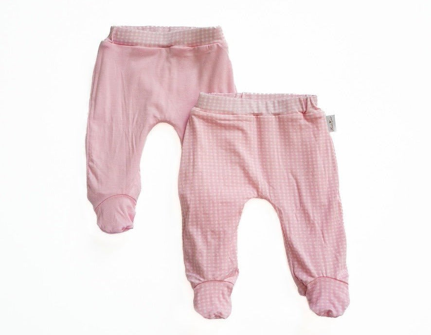 Reversible baby footie pants in pink gingham design.