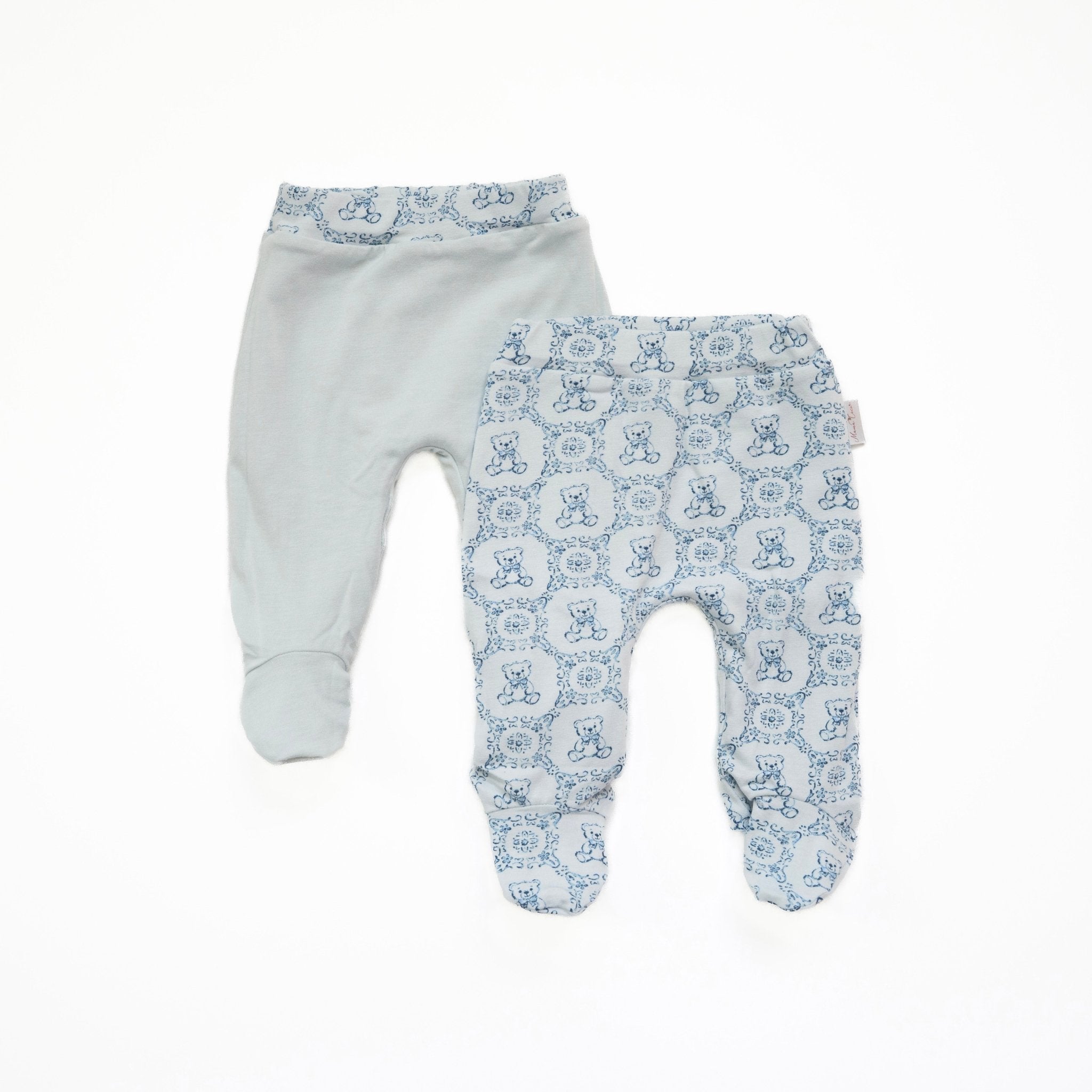 Reversible baby footie pants in teddy tiles design.