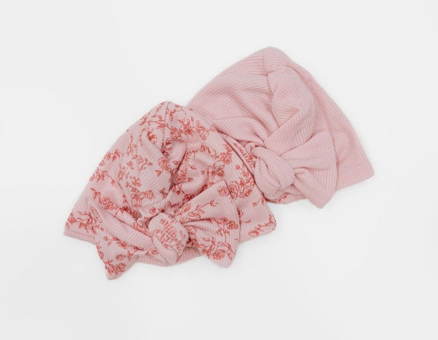 Reversible bitty pink blooms design baby knotty beanie.