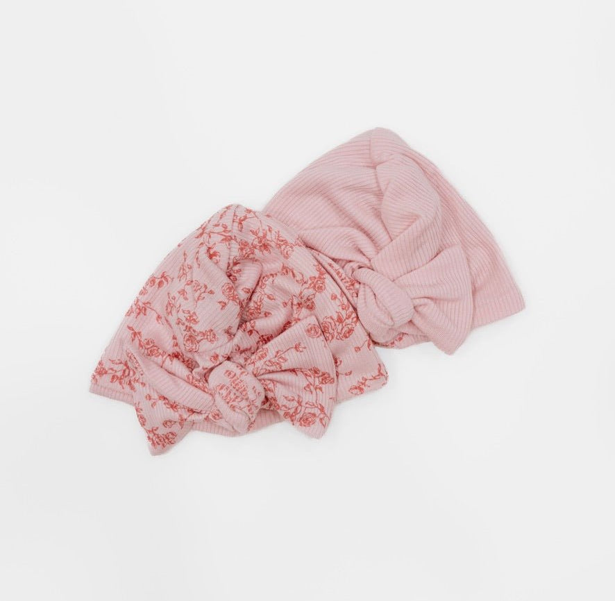 Reversible bitty pink blooms design baby knotty beanie.