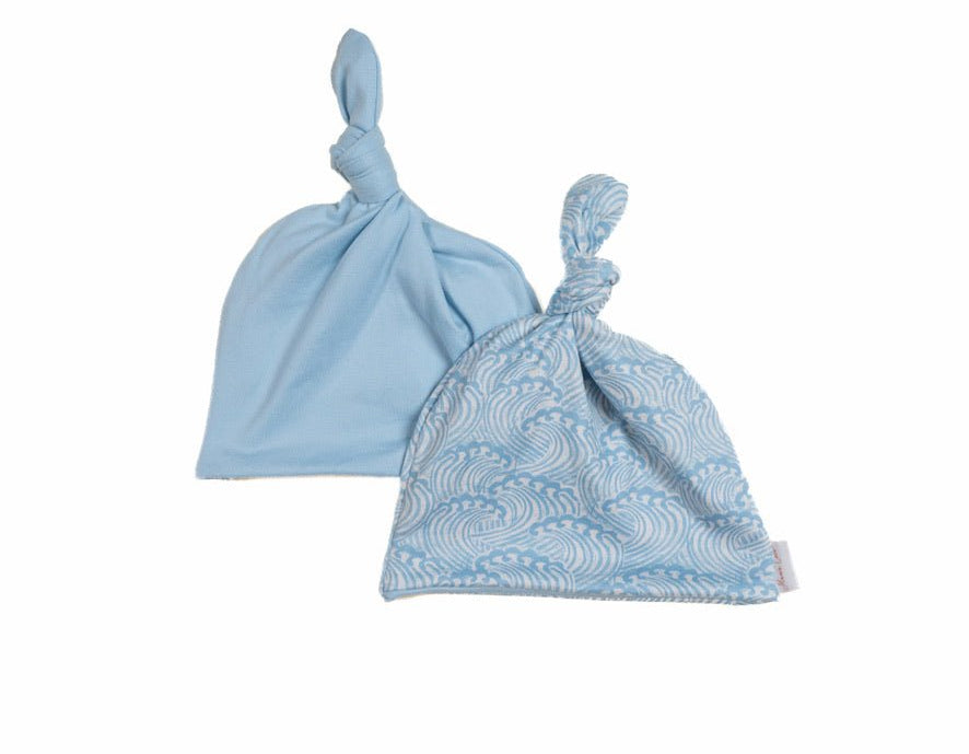 Reversible classic brushed baby beanie in blue swells design.