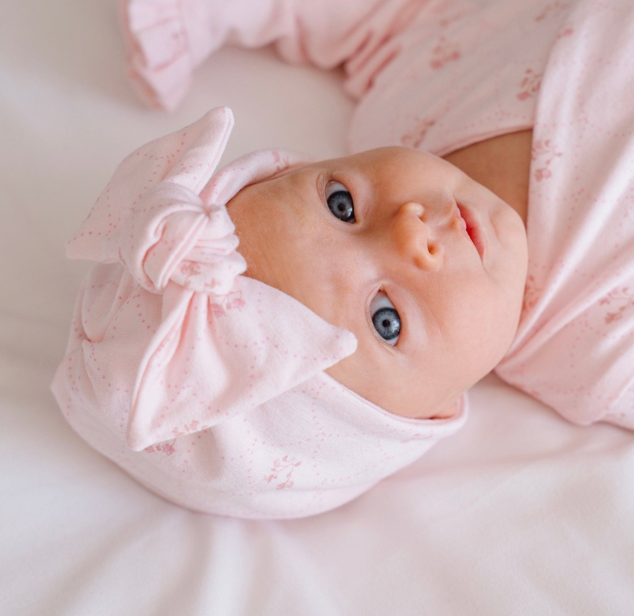 Reversible baby knotty beanie in dainty dots design.