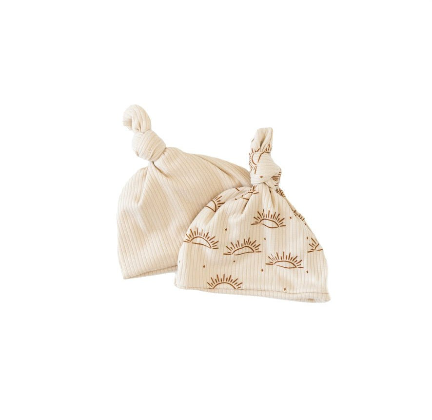 Reversible classic brushed baby beanie in sandy sunsets design.