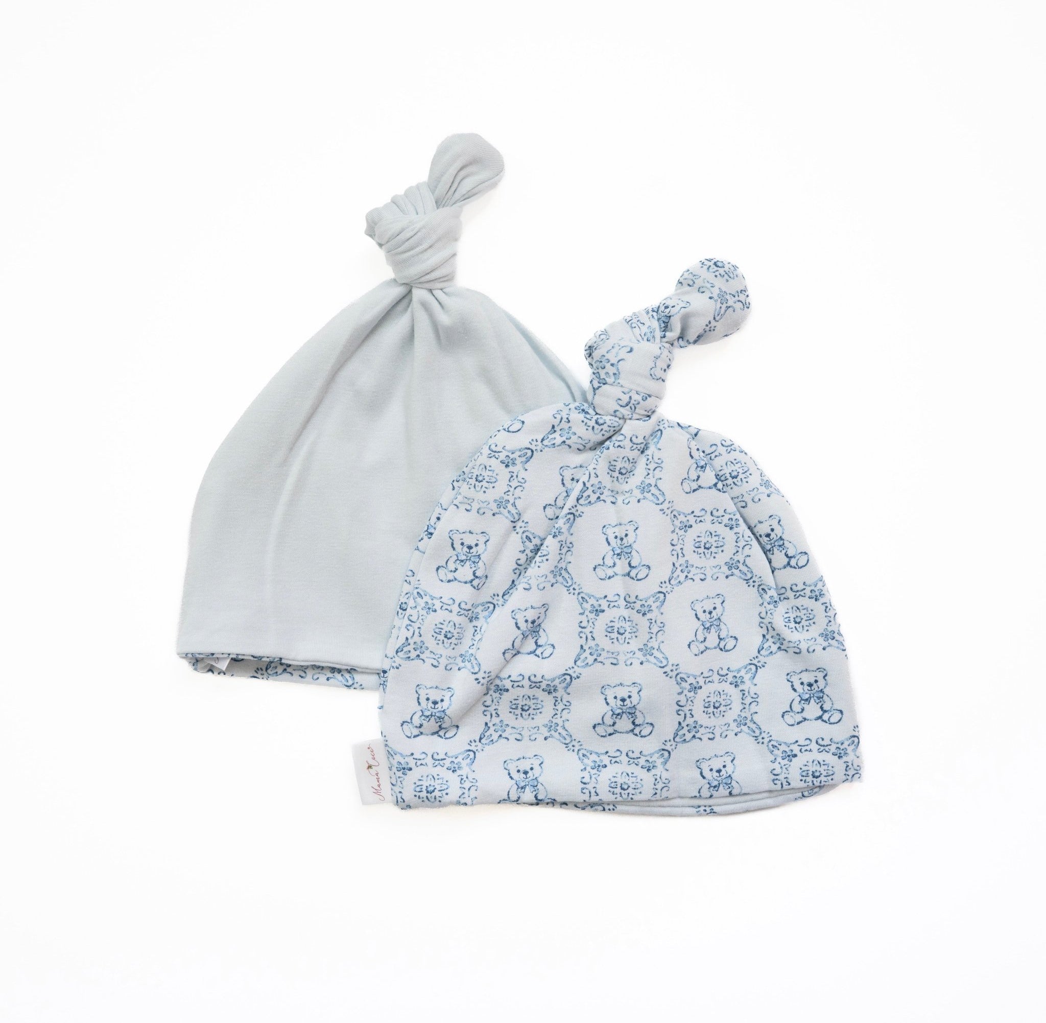 Reversible baby knotty beanie in teddy tiles design.
