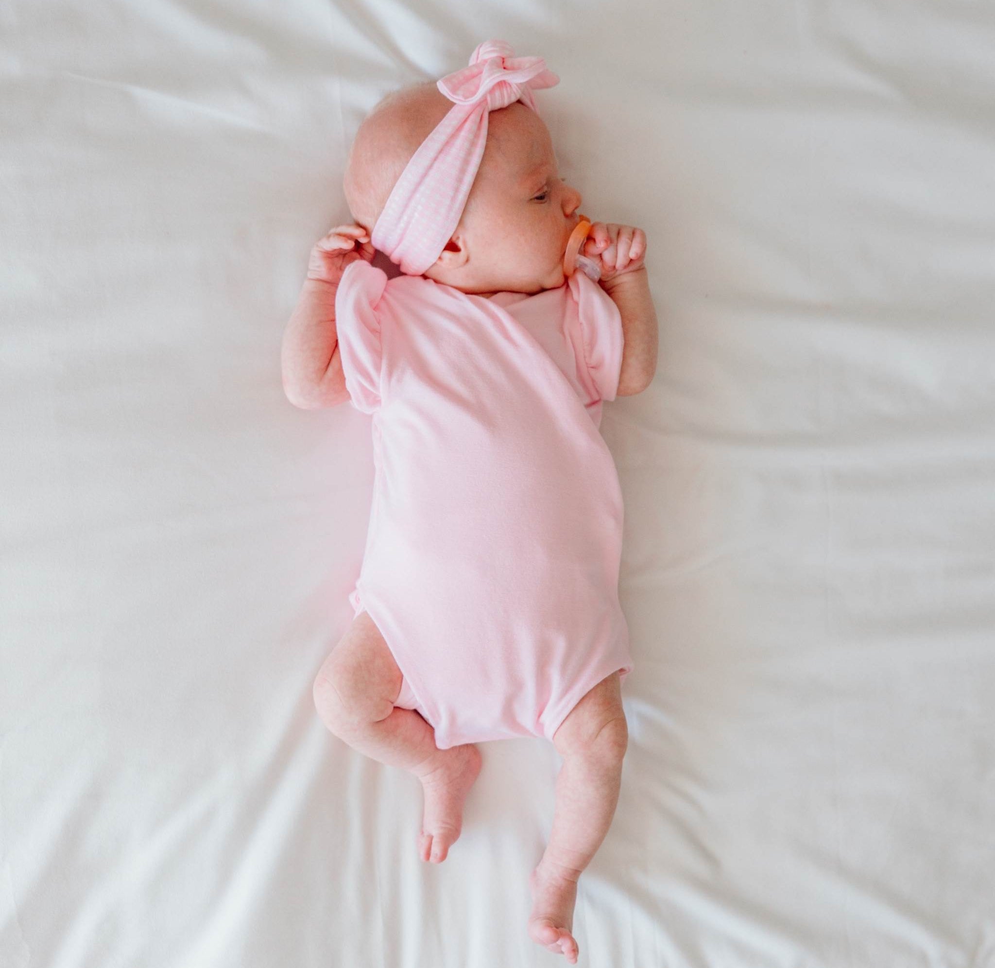 Baby Pink Gingham design flutter sleeve winged bodysuit in silky modal fabric.