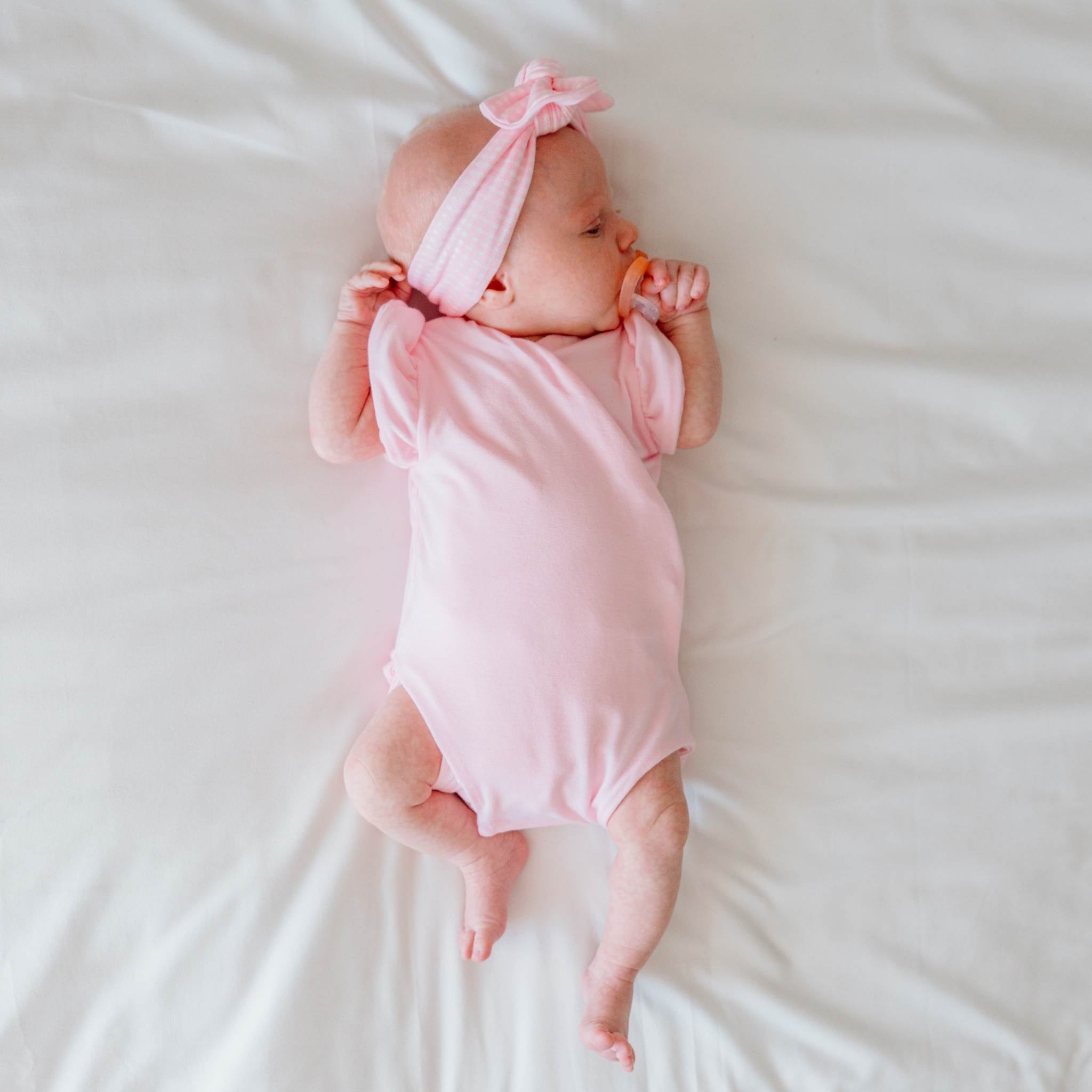 Baby Pink Gingham design flutter sleeve winged bodysuit in silky modal fabric.