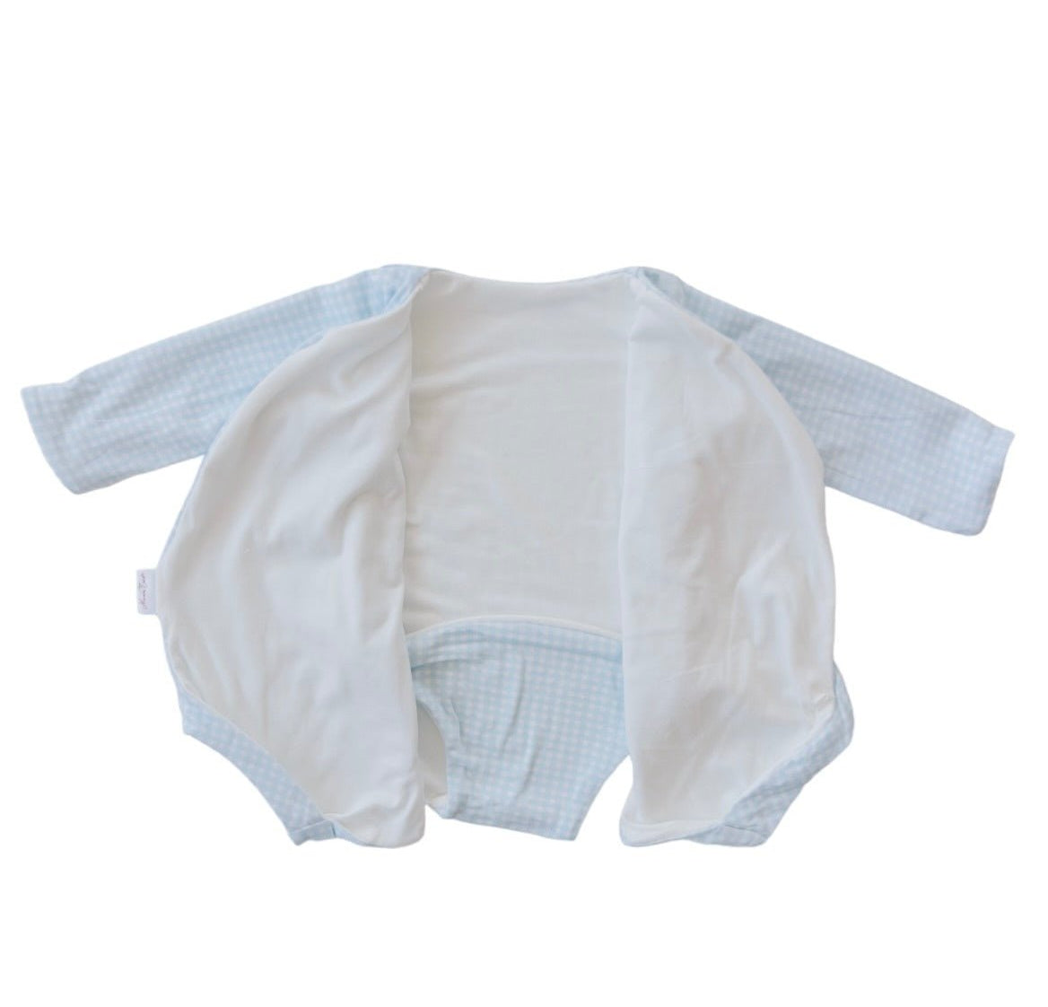 Reversible long-sleeved winged bodysuit for babies in silky modal fabric.