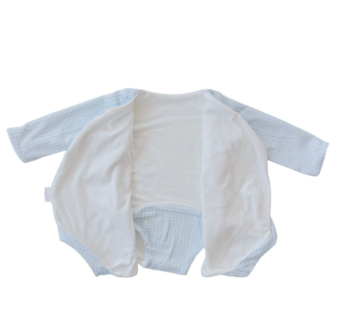 Reversible long-sleeved winged bodysuit for babies in silky modal fabric.