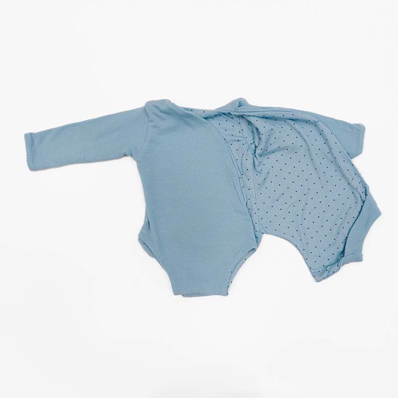 Reversible long sleeved winged bodysuit for babies in silky modal fabric.