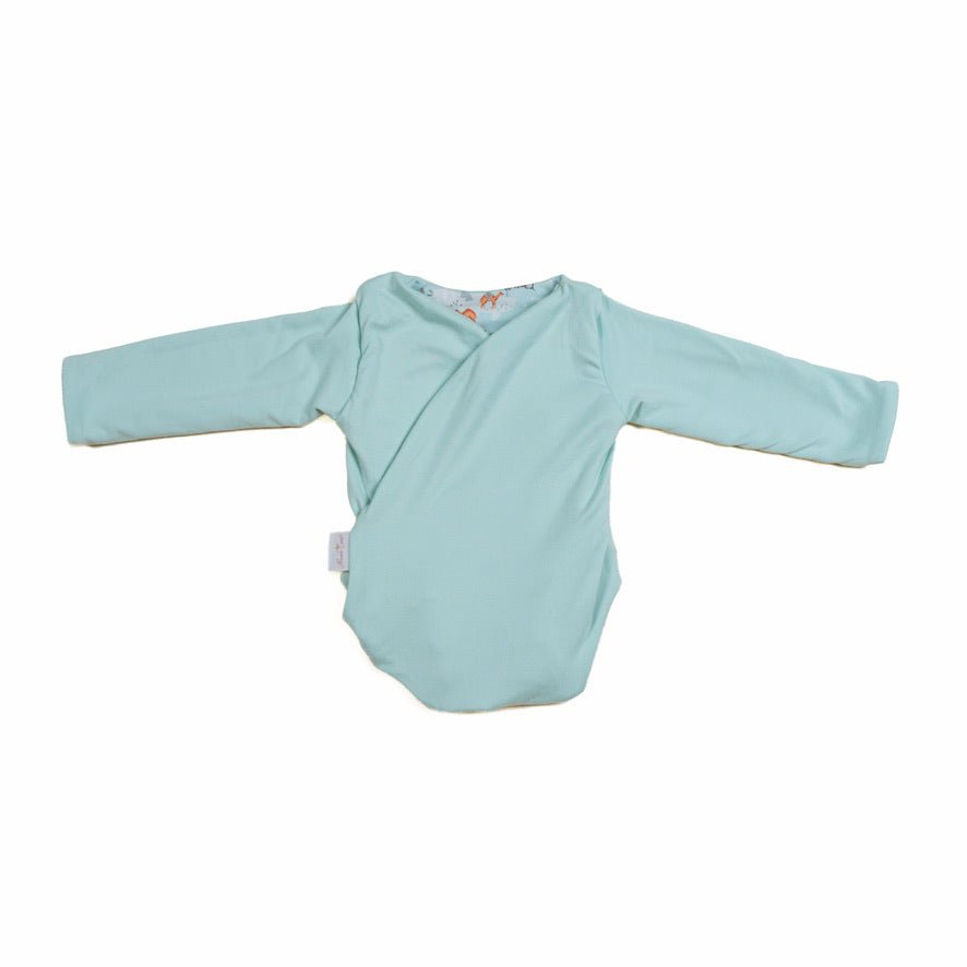 Reversible long sleeved winged bodysuit for babies in classic brushed fabric.