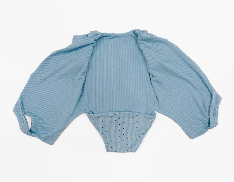 Reversible Dotted Blues design short sleeved winged bodysuit in silky modal fabric.