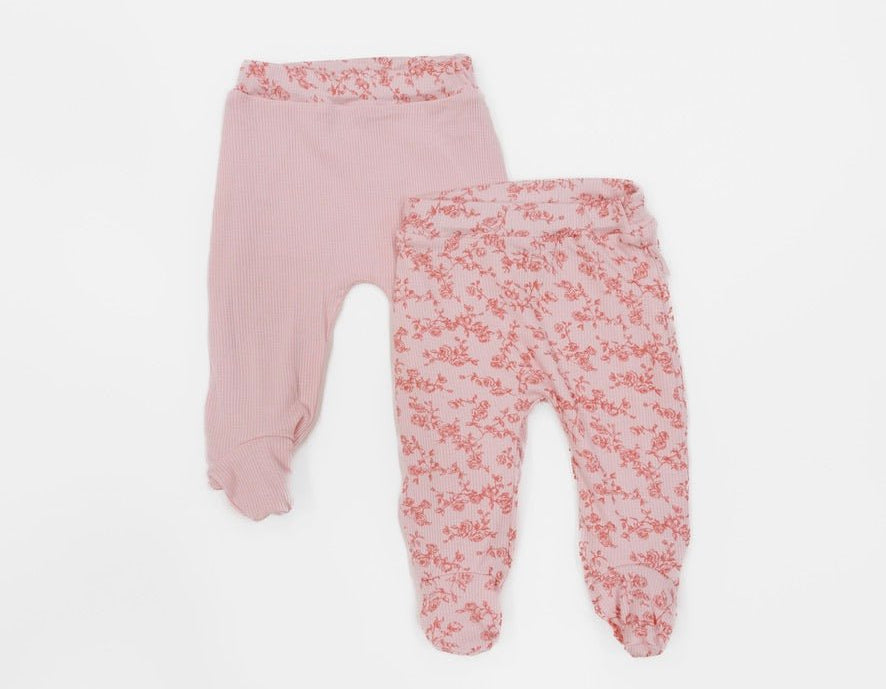Reversible baby footie pants designed in ultra-soft bamboo organic cotton with the Bitty Pink Blooms theme.