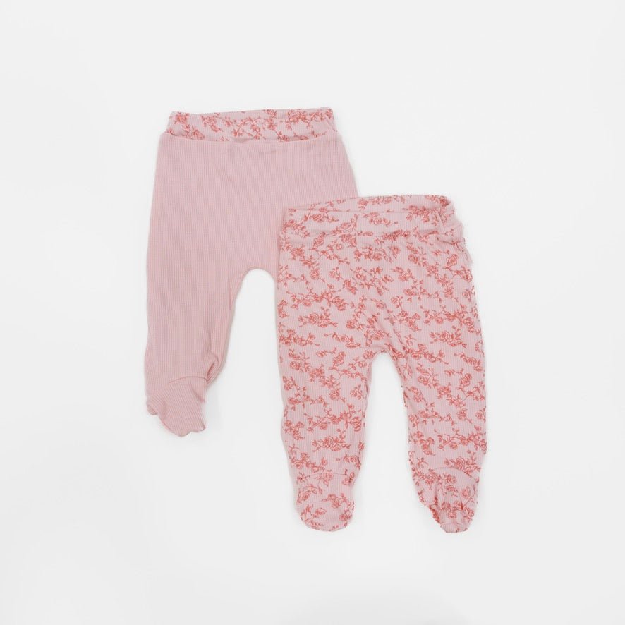 Reversible baby footie pants designed in ultra-soft bamboo organic cotton with the Bitty Pink Blooms theme.