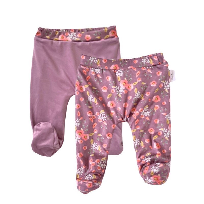 Reversible baby footie pants designed in ultra-soft bamboo organic cotton with the Peachy Lilac theme.