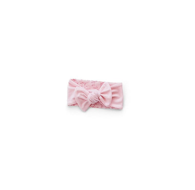 Reversible stylish baby headwrap with bow crafted from ultra-soft bamboo and organic cotton fabric.