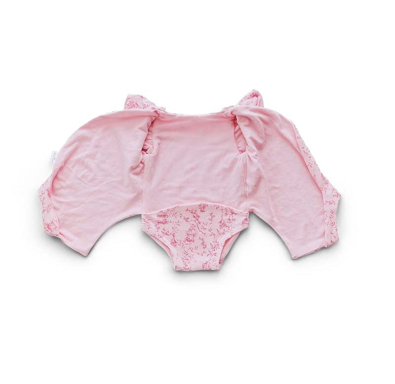 Reversible flutter sleeve winged bodysuit for babies in whimsical garden design.