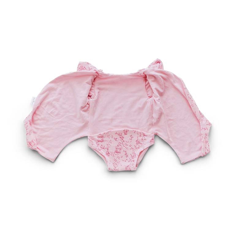 Reversible flutter sleeve winged bodysuit for babies in whimsical garden design.