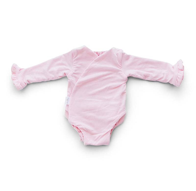 Reversible ruffle cuff long sleeve baby onesie made from bamboo cotton.