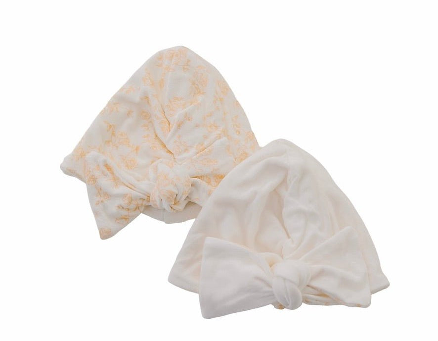 Reversible bitty blooms design baby knotty beanie.