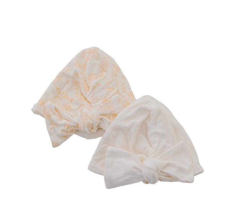 Reversible bitty blooms design baby knotty beanie.