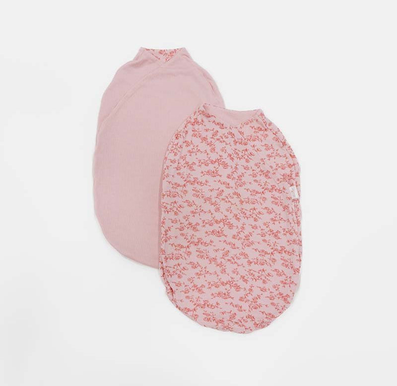 Reversible Bitty Pink Blooms Cocoon swaddle baby blanket in Silky Modal fabric styles with floral charm.