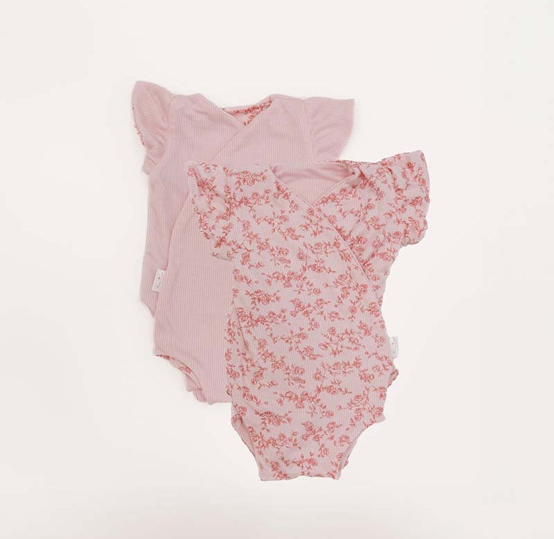 Reversible Bitty Pink Blooms design flutter sleeve winged bodysuit in silky modal fabric.