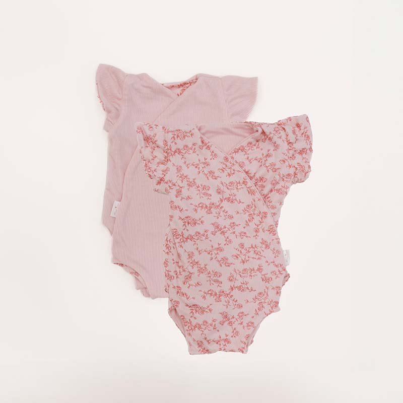 Reversible Bitty Pink Blooms design flutter sleeve winged bodysuit in silky modal fabric.