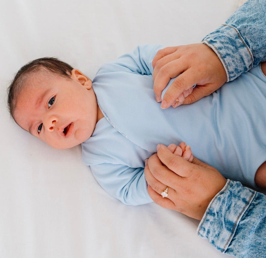Reversible Blue Swells design long sleeved winged bodysuit in classic brushed fabric.