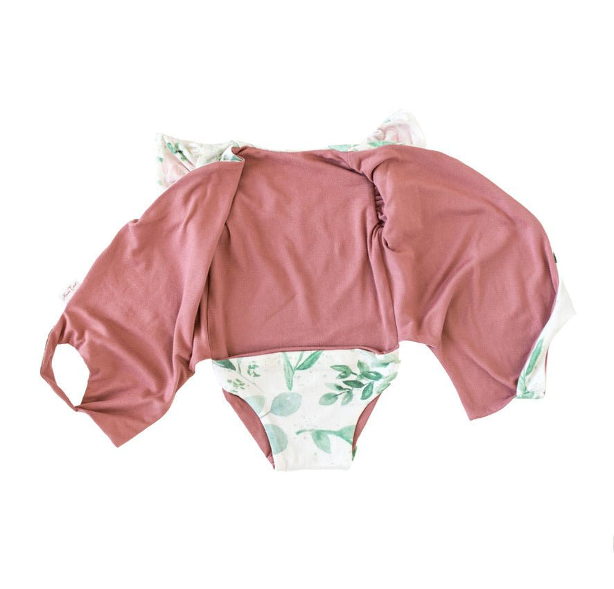 Reversible short-sleeve bodysuit for baby in Classic Brushed fabric styles featuring the Blushing Eucalyptus print.