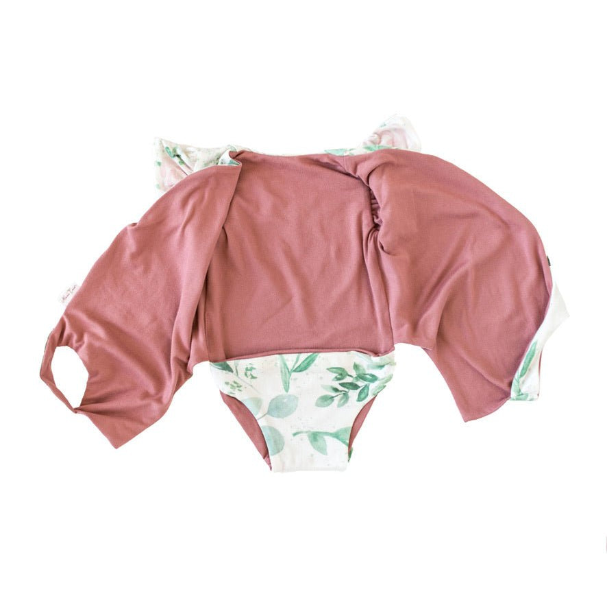 Reversible short-sleeve bodysuit for baby in Classic Brushed fabric styles featuring the Blushing Eucalyptus print.
