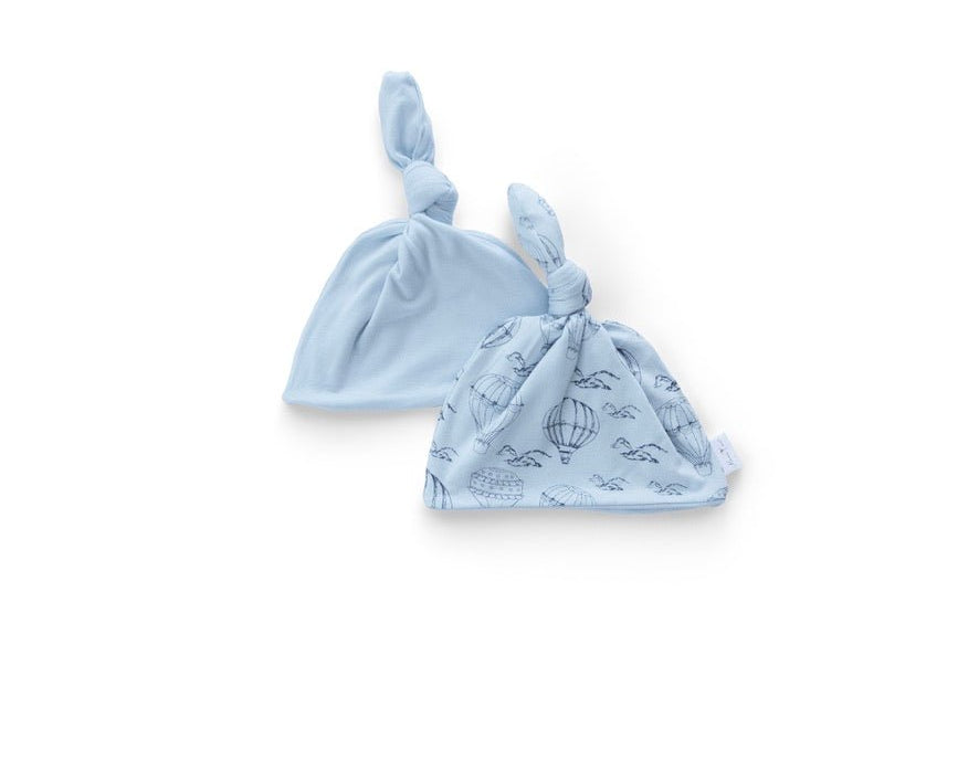 Bon voyage design reversible baby knotty beanie in classic brushed fabric.