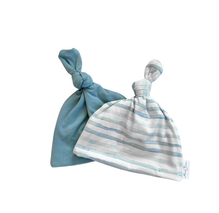 Reversible classic brushed baby beanie in chambray waves design.