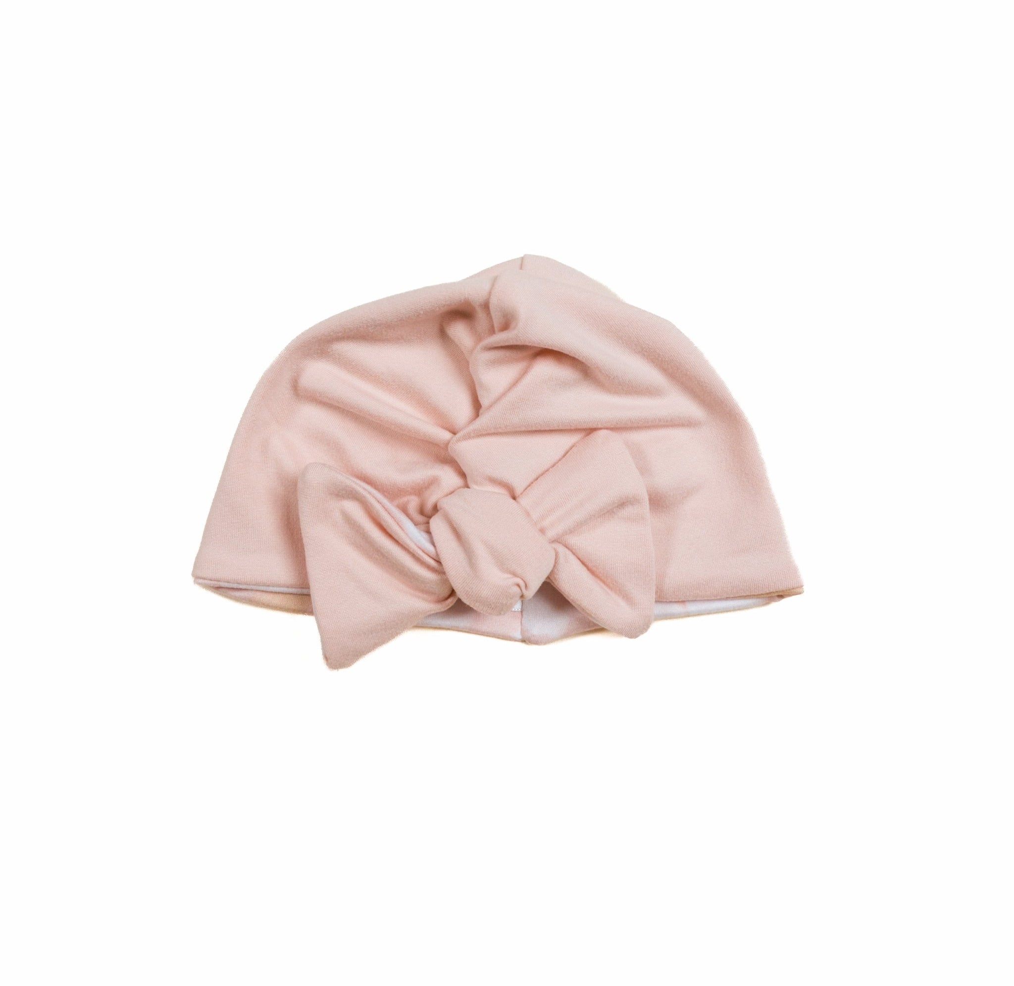 Stretchy ruched baby beanie with bow in soft Dusty Roses classic brushed fabric. Beanie is reversible.