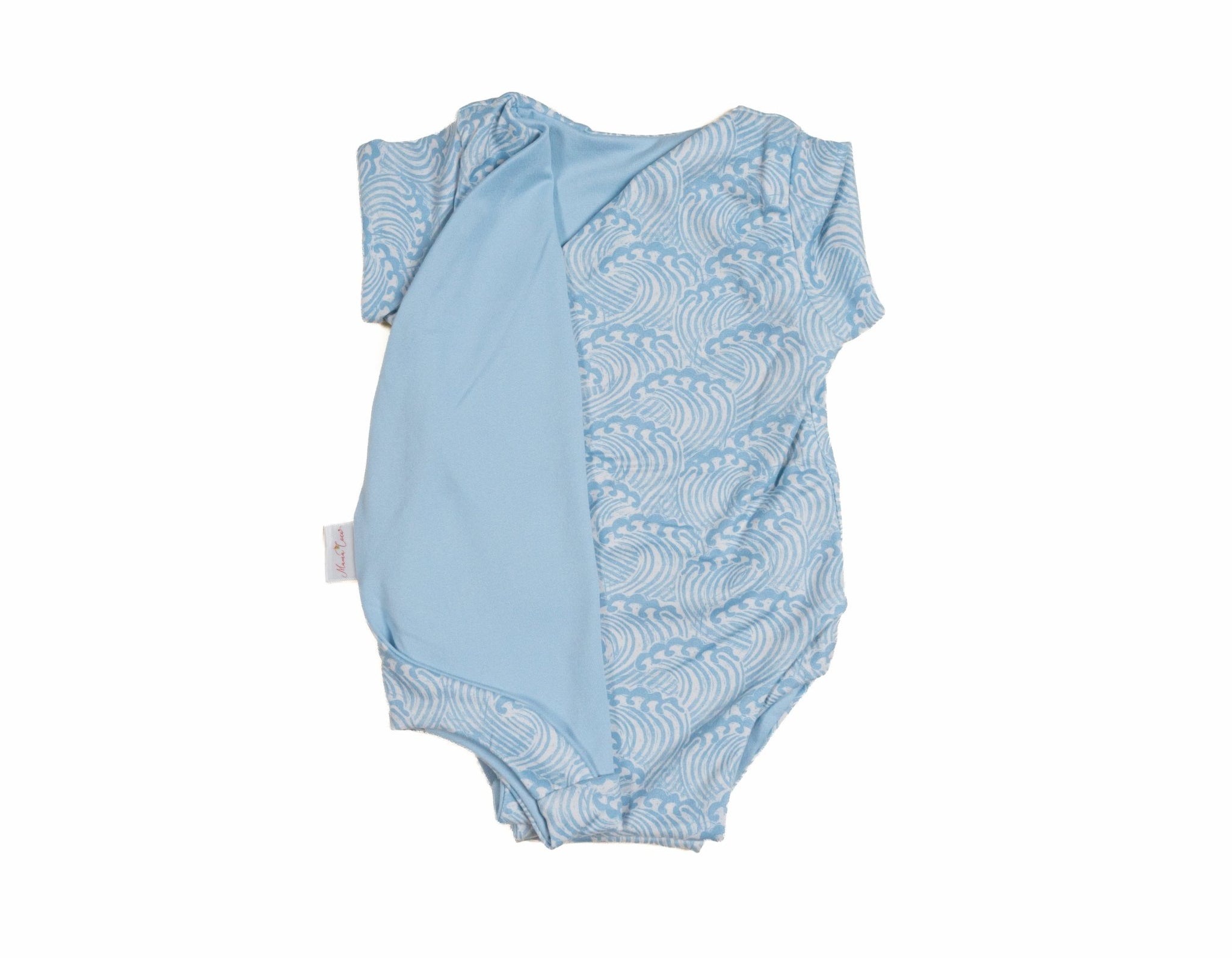 Reversible blue swells design cocoon baby swaddle in classic brushed fabric.