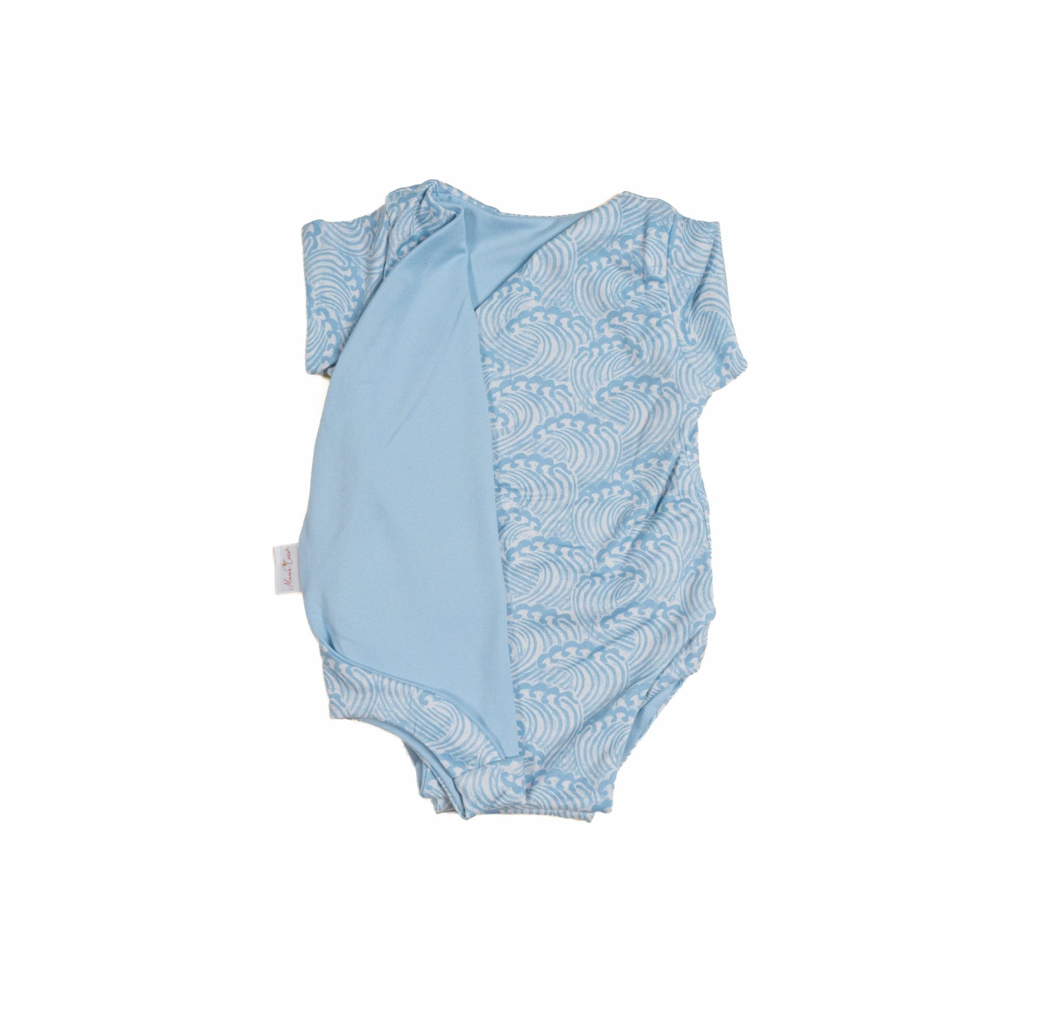 Reversible blue swells design cocoon baby swaddle in classic brushed fabric.