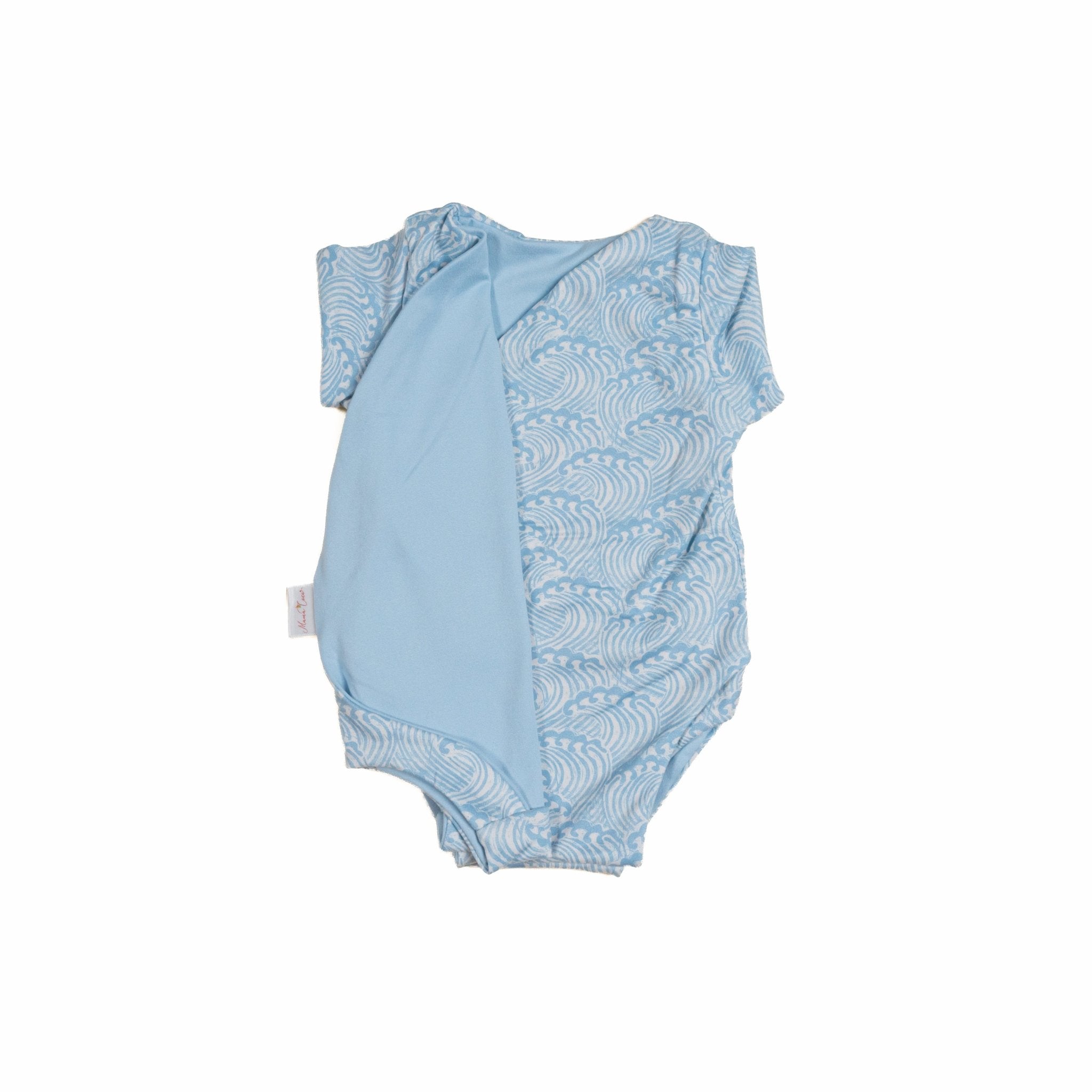 Reversible blue swells design cocoon baby swaddle in classic brushed fabric.
